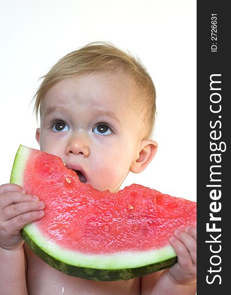 Image of cute toddler eating a big piece of watermelon. Image of cute toddler eating a big piece of watermelon