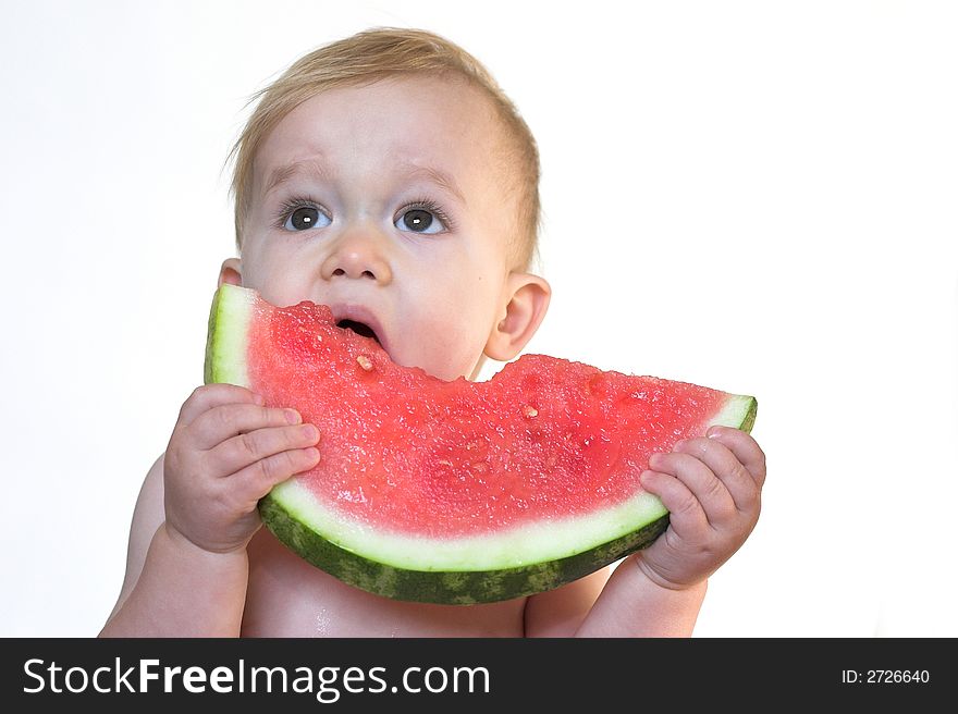 Image of cute toddler eating a big piece of watermelon. Image of cute toddler eating a big piece of watermelon