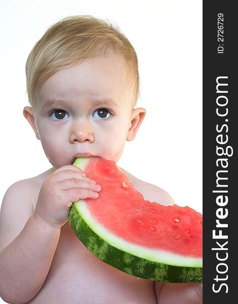 Image of cute toddler eating a big piece of watermelon. Image of cute toddler eating a big piece of watermelon