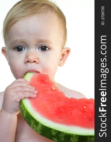 Image of cute toddler eating a big piece of watermelon. Image of cute toddler eating a big piece of watermelon