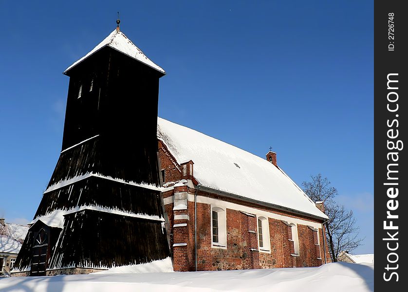 Very old (built in 1481) catholic church in Klewki (Klaukendorf), Poland. Photo taken during winter. Very old (built in 1481) catholic church in Klewki (Klaukendorf), Poland. Photo taken during winter.