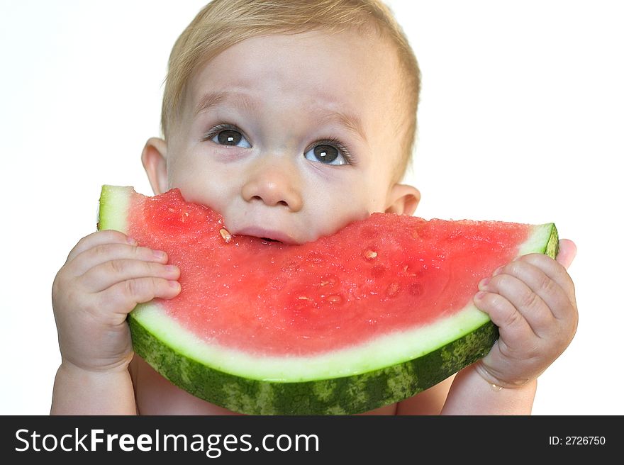 Image of cute toddler eating a big piece of watermelon. Image of cute toddler eating a big piece of watermelon