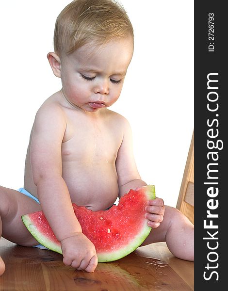 Image of cute toddler eating a big piece of watermelon. Image of cute toddler eating a big piece of watermelon