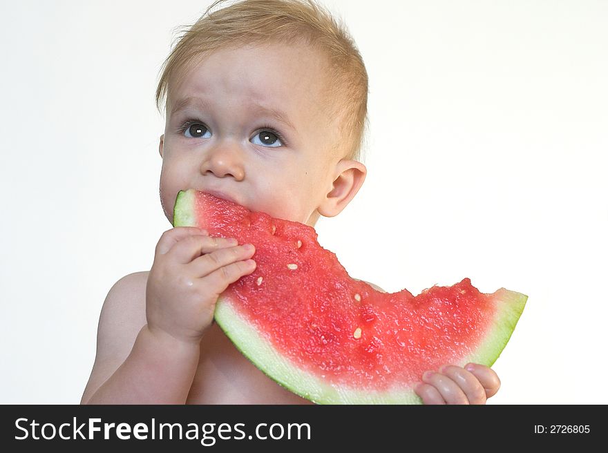 Image of cute toddler eating a big piece of watermelon. Image of cute toddler eating a big piece of watermelon