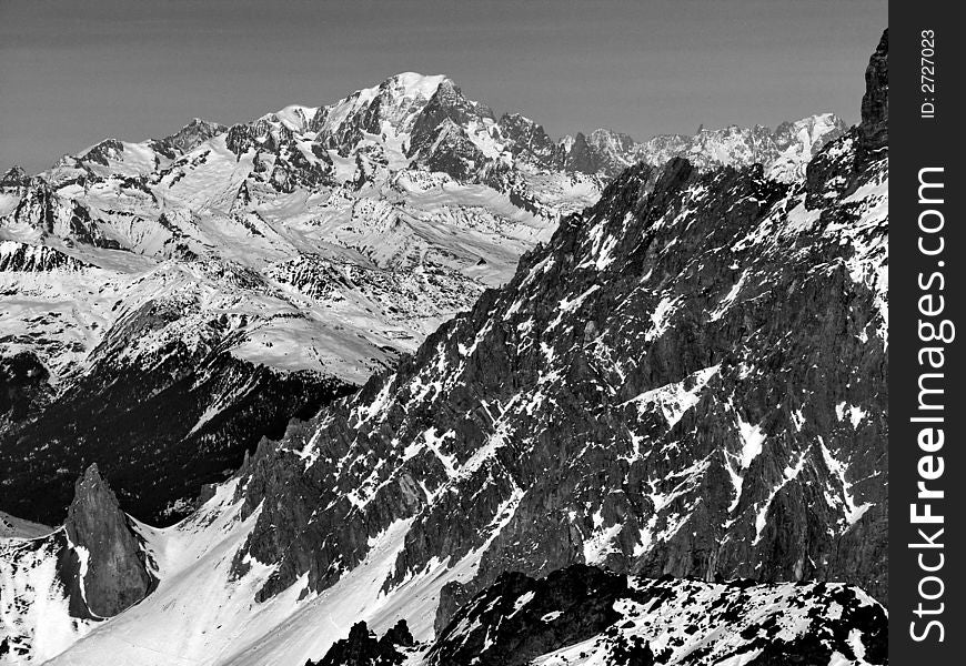 Rocks of French Alps with peak of Mont Blanc. Rocks of French Alps with peak of Mont Blanc