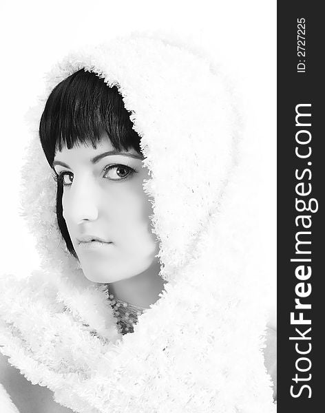 Portrait of a beautiful brunette in winter scarf. Black and white image. Portrait of a beautiful brunette in winter scarf. Black and white image