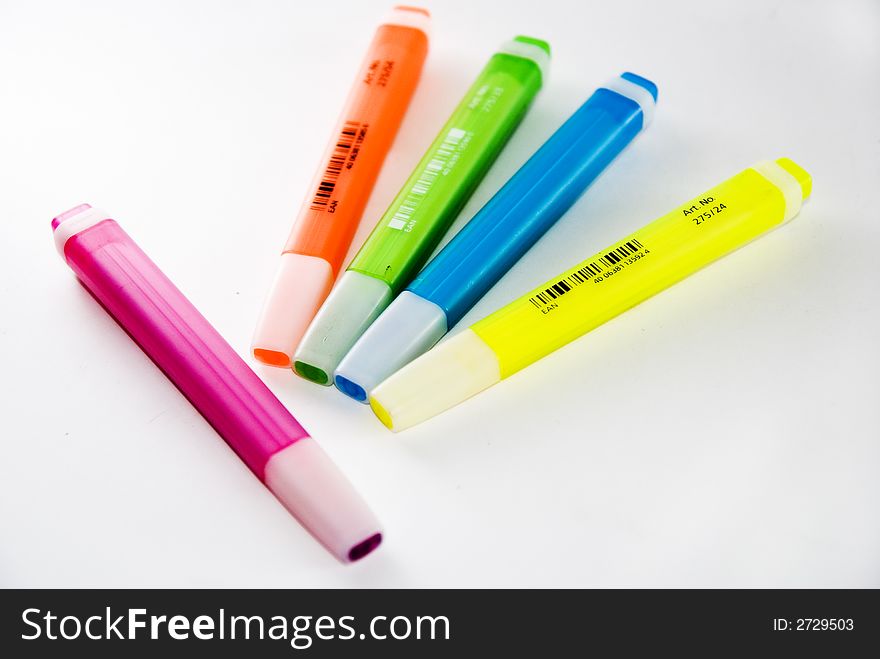 A variety of different bright coloured highlighter pens. Used oftenly in offices and school. A variety of different bright coloured highlighter pens. Used oftenly in offices and school