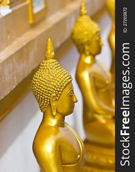 A closeup golden Buddha statues, Buddhist religion. A closeup golden Buddha statues, Buddhist religion.