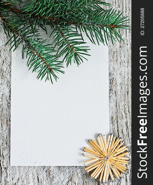 Christmas card with firtree branch