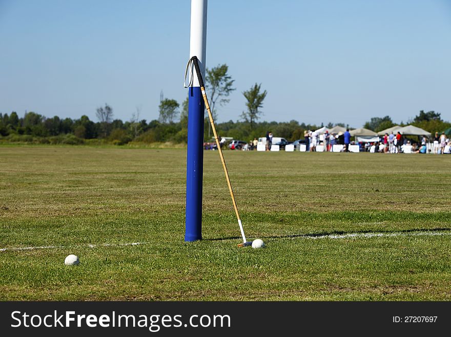 Polo balls and mallet standing by a goal post before the game start. Polo balls and mallet standing by a goal post before the game start.