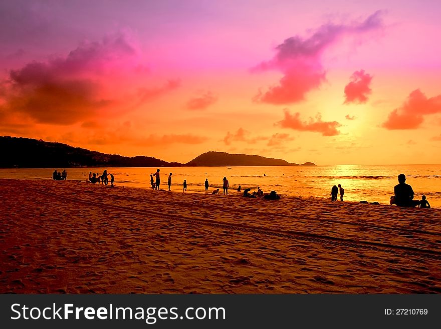 Silhouette People at sunset on Patong beach, South of Thailand