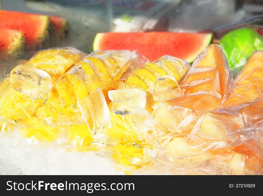 Fruit in the ice, Pineapple, Watermelon and cantaloupe melon. Fruit in the ice, Pineapple, Watermelon and cantaloupe melon