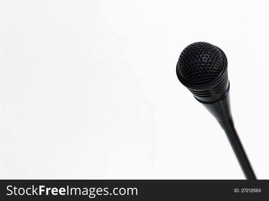 Microphone which is used to announce something with a white background. Microphone which is used to announce something with a white background