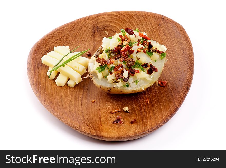 Baked Potato with Cheese, Paprika and Spring Onion on Wooden plate  on white background