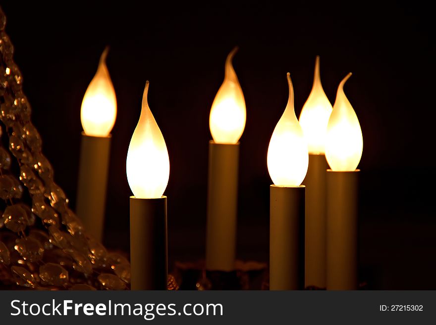 Some light-bulbs in the form of a candle flame. Some light-bulbs in the form of a candle flame