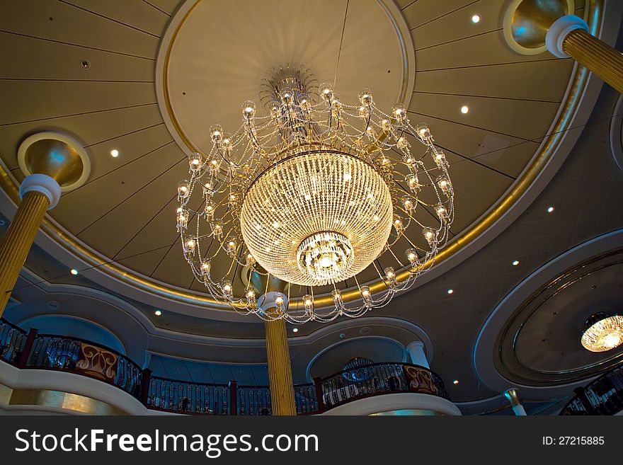 Magnificent chandelier on the ceiling of the cruise ship