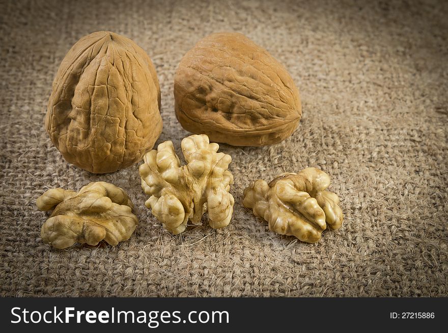 Some nuts , walnuts on sack texture