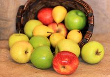 A Basket Of Ripe Apples And Pears Stock Photo