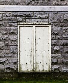 Beige Door In A Stone Wall. Stock Images