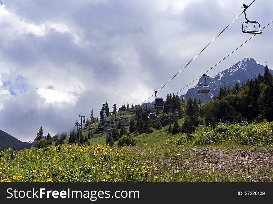 Ropeway in mountain Shymbulak under cloudy sky in Kazakhstan, Almaty. Ropeway in mountain Shymbulak under cloudy sky in Kazakhstan, Almaty