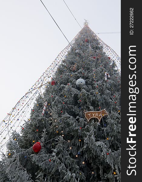 Frosty Christmas tree with lights and decorations