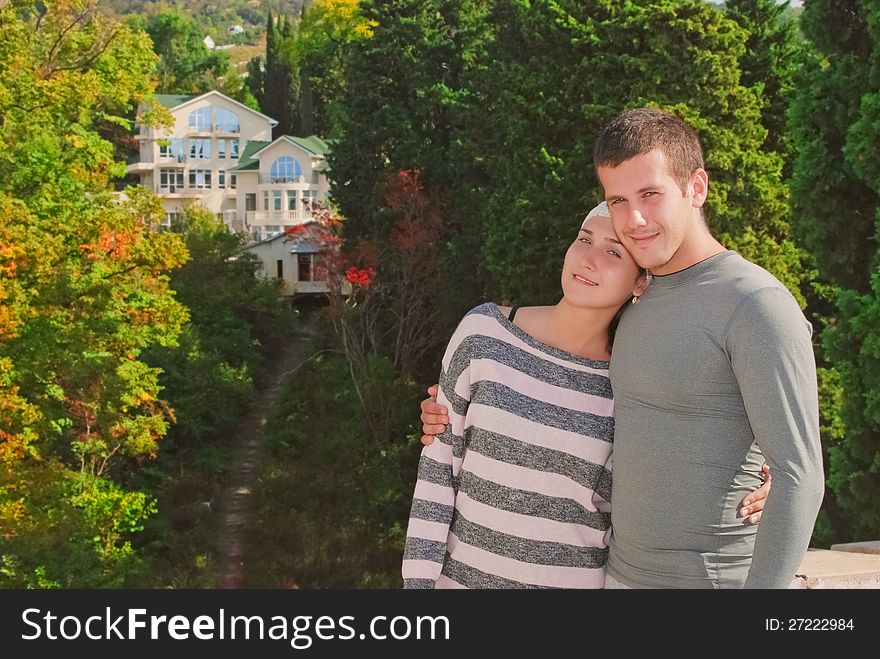 Young couple on the background of a beautiful home