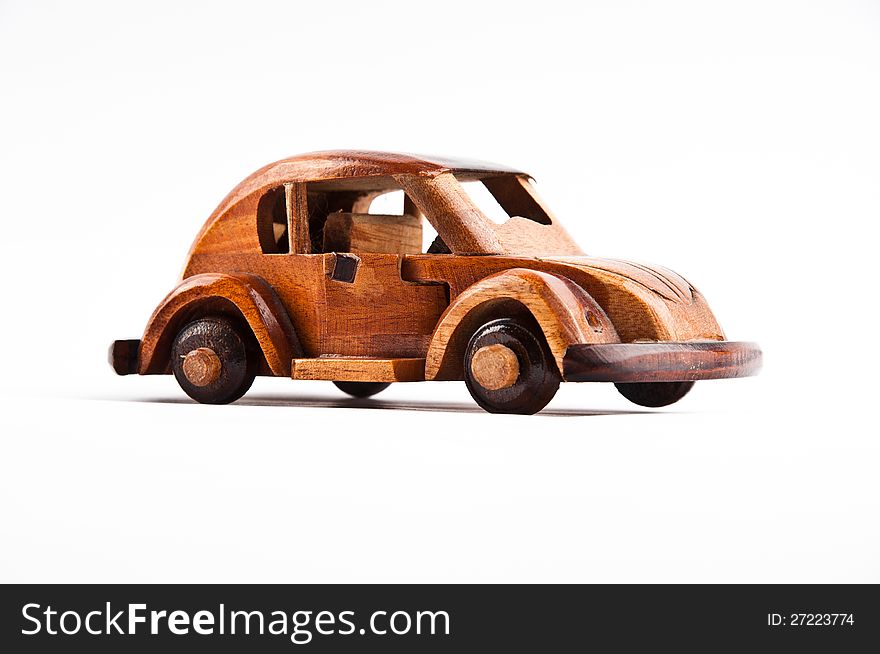 Retro wooden car model isolated on white