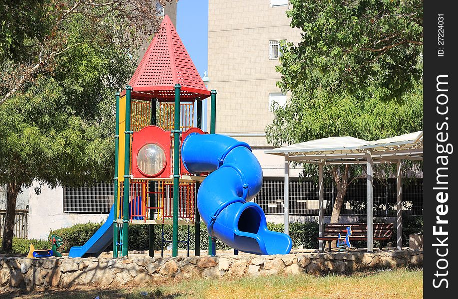 Modern children playground in park in a residential area. Modern children playground in park in a residential area