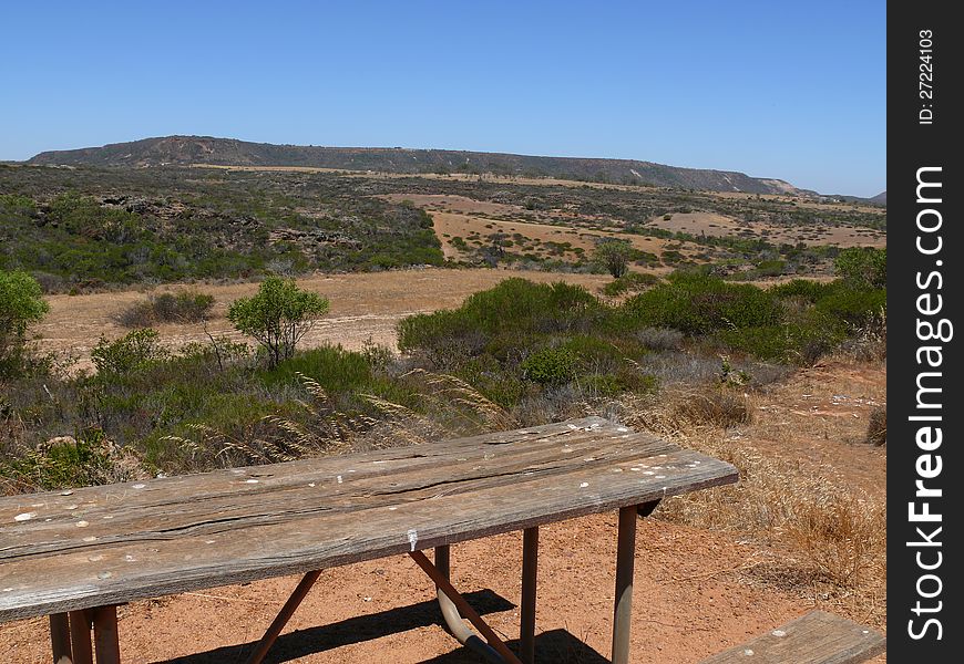 Western Australia, Landscape of the hilly savannah with small bench and table. Western Australia, Landscape of the hilly savannah with small bench and table.