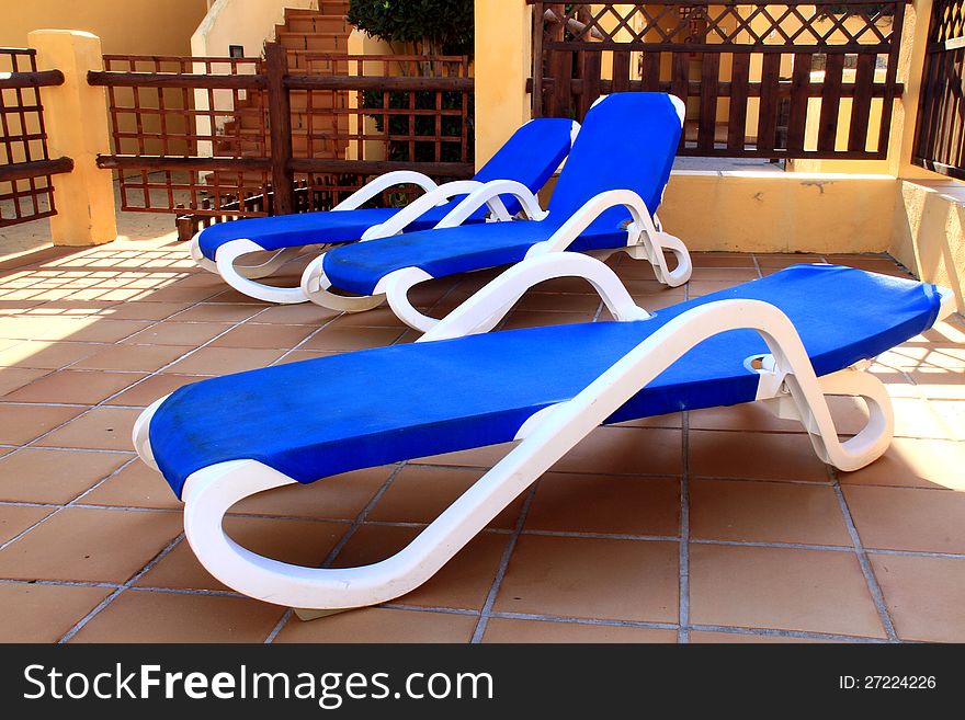 Image of deckchairs within a hotel area