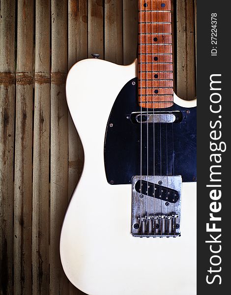 Grunge  wooden background with electric guitar