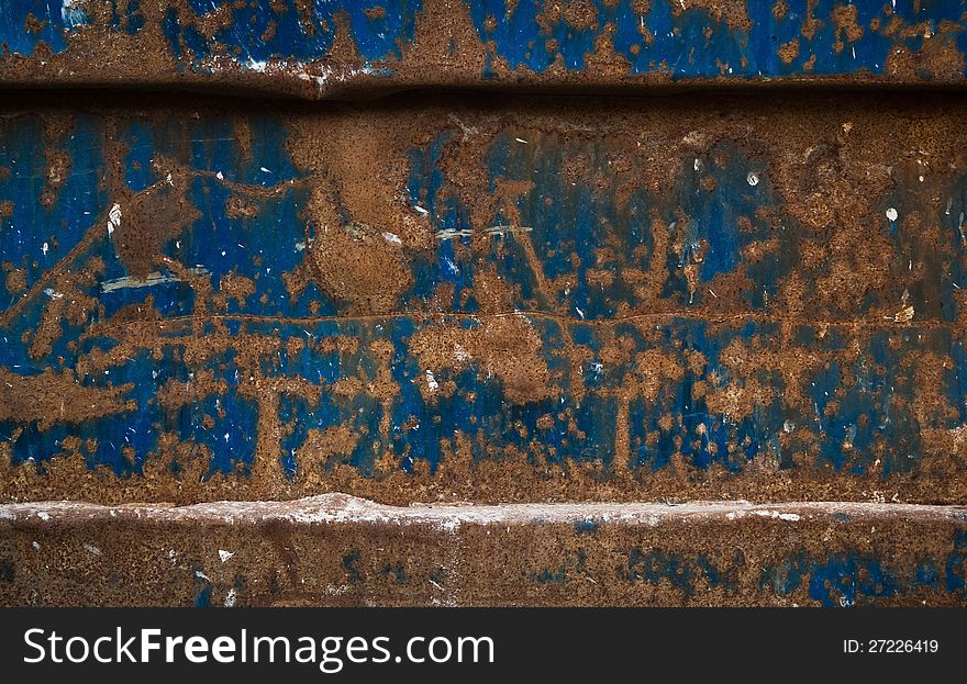 This is a really old and rusty blue painted metal dumpster. This is a good color contrast... blue and orange is like hot and cold. This is a really old and rusty blue painted metal dumpster. This is a good color contrast... blue and orange is like hot and cold.