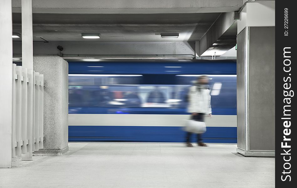 Someone waiting the metro. A long exposure of the wagon that show the movements and a blurry men just standing there. Someone waiting the metro. A long exposure of the wagon that show the movements and a blurry men just standing there.