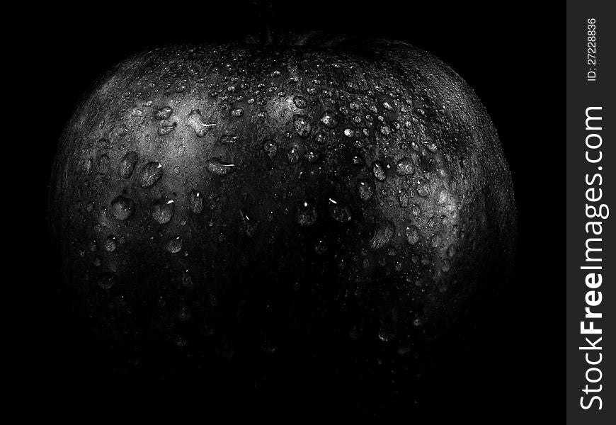 The apple on a black background
