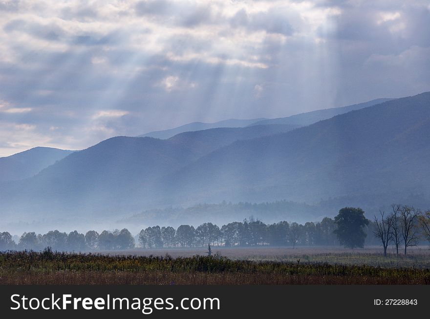 Sunrays cover the open fields of Cades Cove.