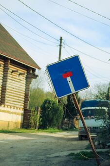An Old Beveled Road Sign.  The Iconic Designation & X22 Dead End& X22 . Rural Road. An Old Truck In The Background. Royalty Free Stock Photo
