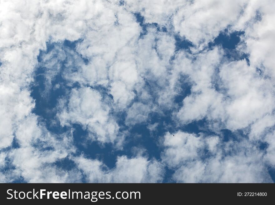 Blue sky with cumulus clouds, light and shadow distance and height