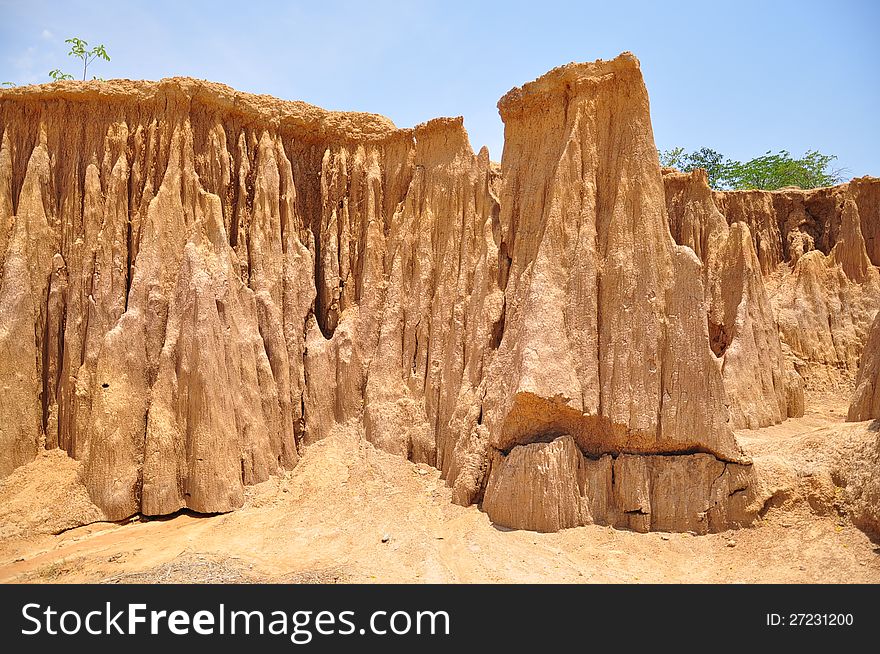 Lalu is Sakaeo Province in Thailand. They are an amazingly beautiful site of nature wonder. At this natural attraction, some part of the soil is still hard and has been eroded into shapes similar to a wall or pillars.