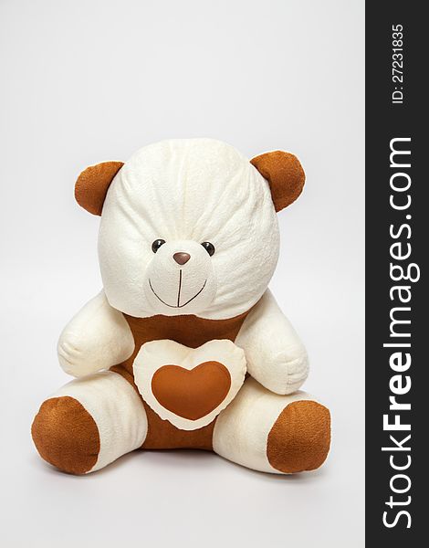 A teddy-bear with heart, over white white,  Image may be useful for Valentines. A teddy-bear with heart, over white white,  Image may be useful for Valentines.