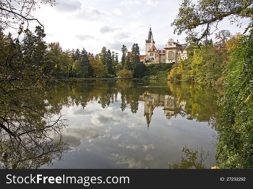 Průhonice park and castle with reflection in the water in the fall. Průhonice park and castle with reflection in the water in the fall