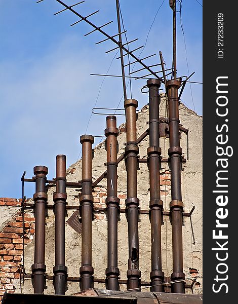 A multitude of Chimney in a building of a small factory in Bucharest, Romania