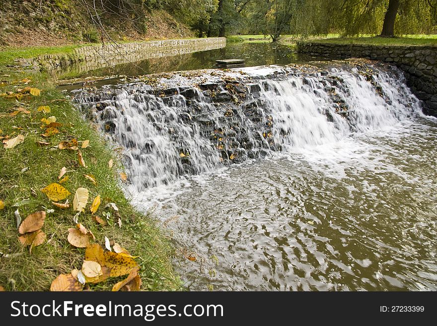 River weir in the fall. River weir in the fall