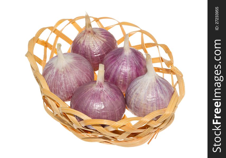 Garlic in a basket, isolated. Garlic in a basket, isolated