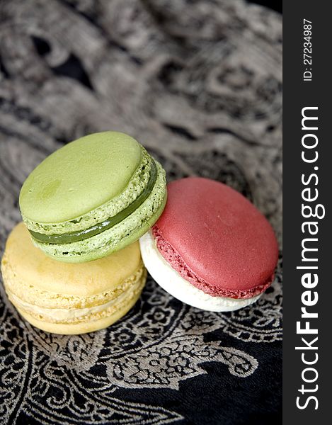 French macarons put on black background. French macarons put on black background
