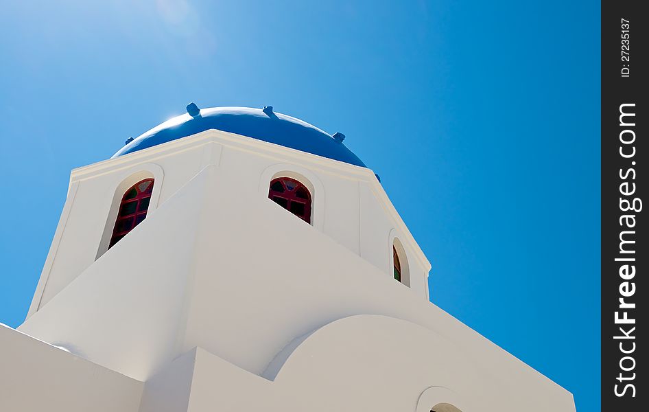 The white walls of the Christian Church are directed upwards, on a background of blue sky. The white walls of the Christian Church are directed upwards, on a background of blue sky.