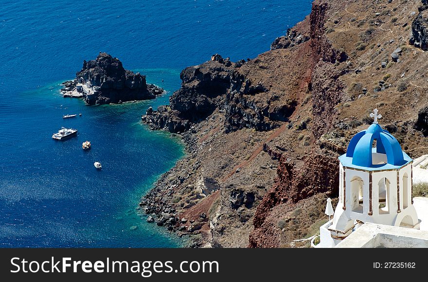 Blue dome of the Christian bell, looking beautiful against the blue sea and the caldera of Santorini. Blue dome of the Christian bell, looking beautiful against the blue sea and the caldera of Santorini.