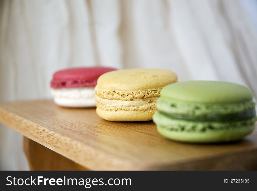 Close up vanilla cream macaron in line. Close up vanilla cream macaron in line