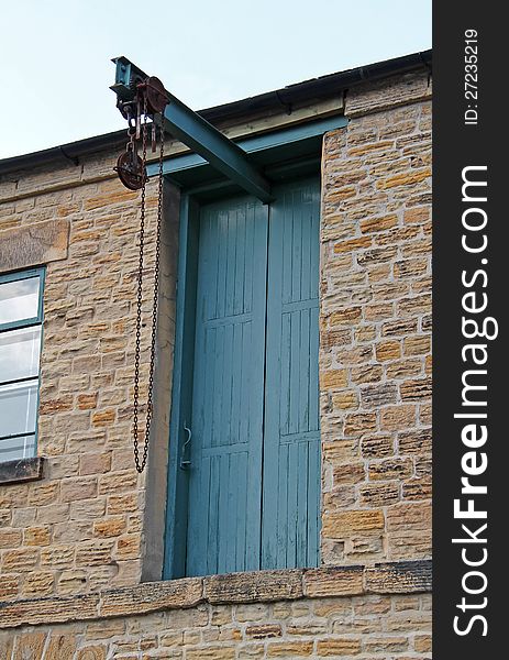 A Vintage Loading Pulley and Hoist for a Warehouse. A Vintage Loading Pulley and Hoist for a Warehouse.