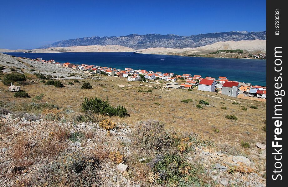 The pag village in croatia (southeast europe) during summer. Pag is a Croatian island is in the northern Adriatic Sea. It is the fifth-largest island of the Croatian coast, and the one with the longest coastline. The pag village in croatia (southeast europe) during summer. Pag is a Croatian island is in the northern Adriatic Sea. It is the fifth-largest island of the Croatian coast, and the one with the longest coastline.
