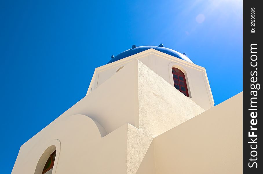 The white walls of the Christian Church are directed upwards, on a background of blue sky. The white walls of the Christian Church are directed upwards, on a background of blue sky.